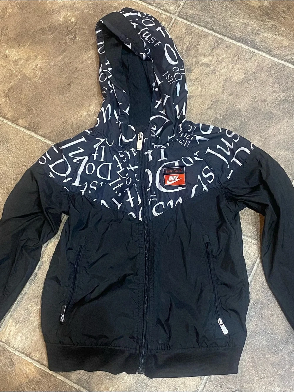 Nike Kids Black Hooded Rain Jacket with White Script